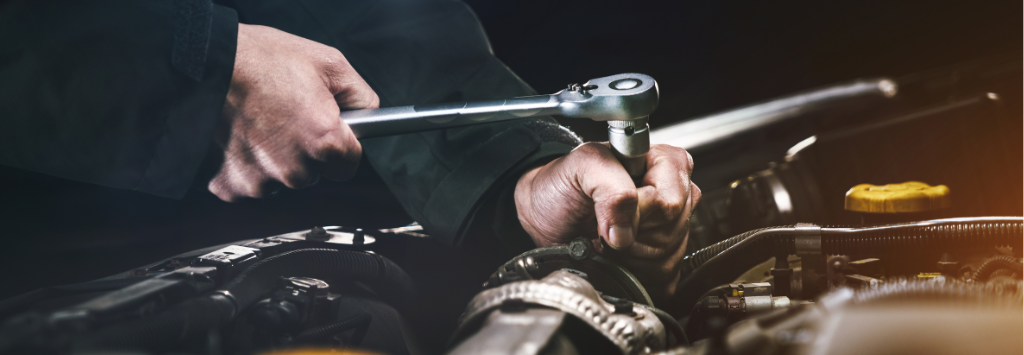 mechanic working on an engine