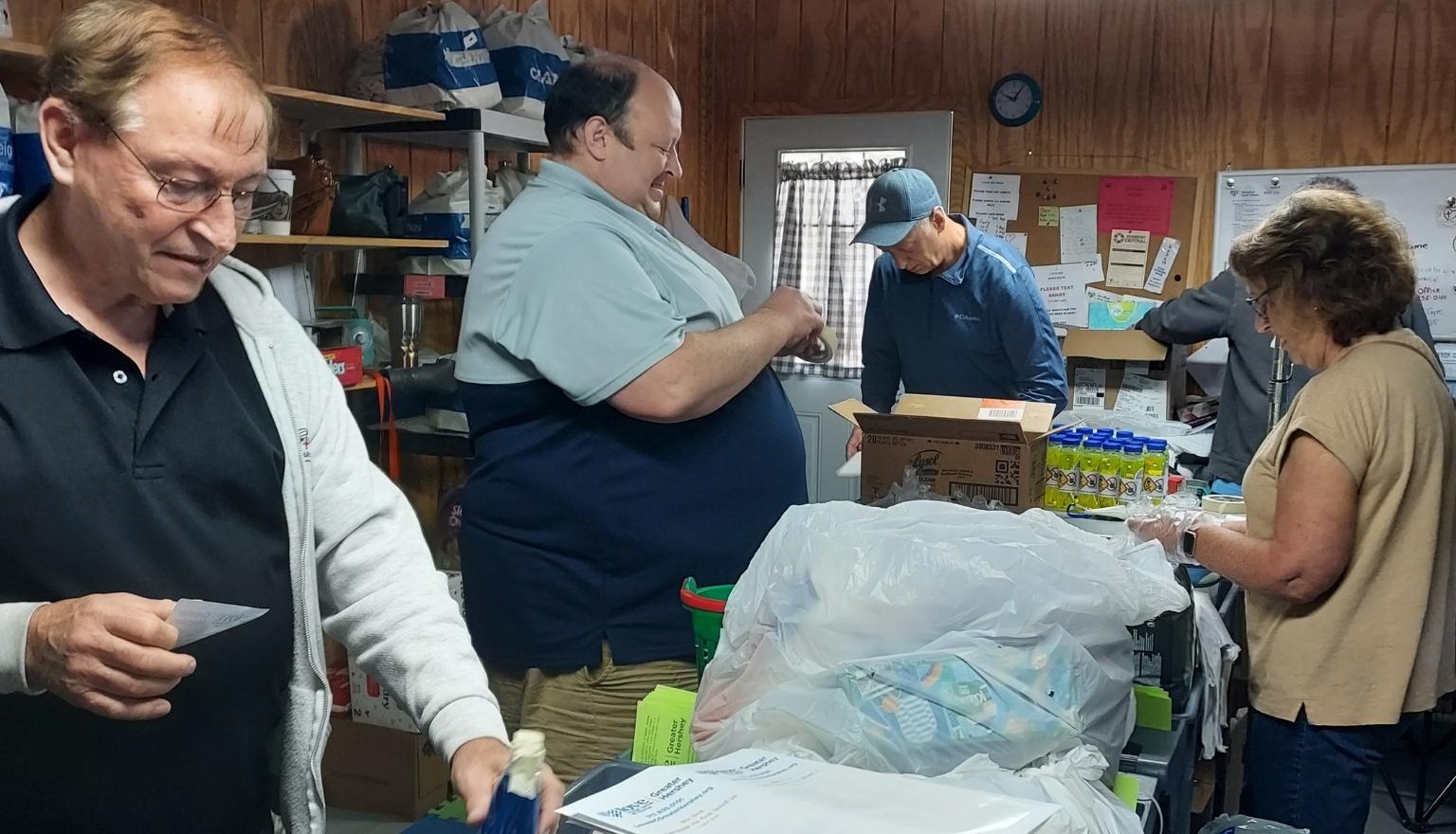 Volunteers helping in the Personal Care Closet